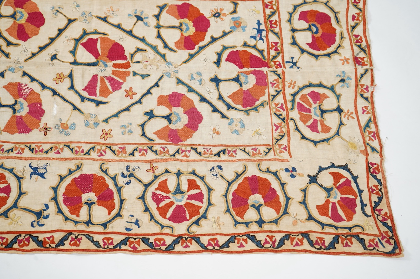 A 19th century Uzbekistan Suzani, hand embroidered hanging. Made from hand woven linen panels each approximately 28cm wide x 167cm long. Hand embroidered with silk hand dyed threads, in orange, red, blue and yellows, usi
